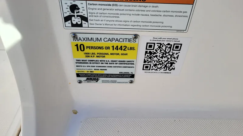 Slide: The Image of Regal 21 OBX PROJECT 2020 boat capacity label, 10 persons or 1442 lbs, safety warnings. - 23