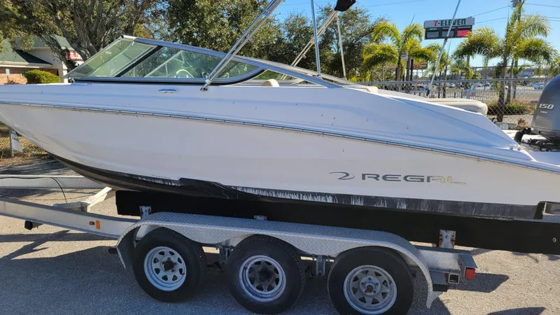 Slide: The Image of 2020 Regal 21 OBX PROJECT boat on trailer, side view, sunny day. - 6