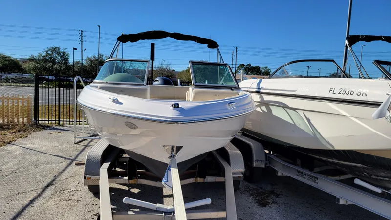 Slide: The Image of 2020 Regal 21 OBX PROJECT boat on trailer, parked outdoors. - 8