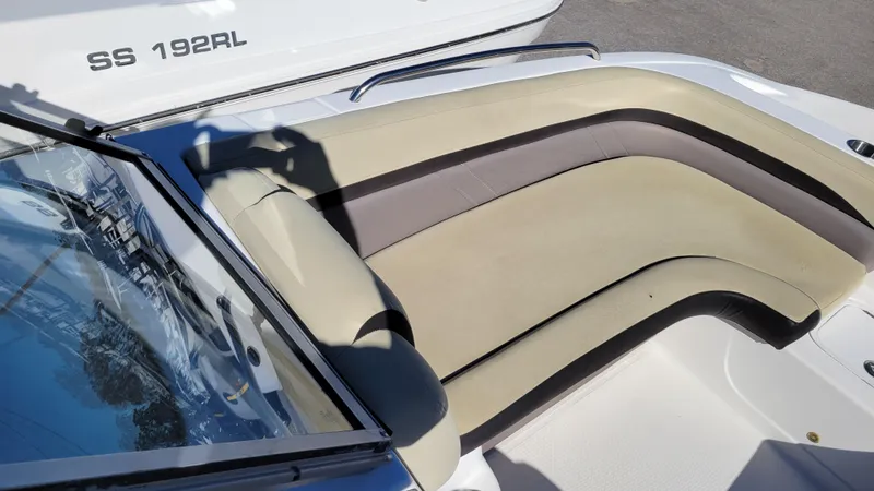 Slide: The Image of 2019 Hurricane SUNDECK 217 PROJECT boat interior with beige seating and windshield. - 13