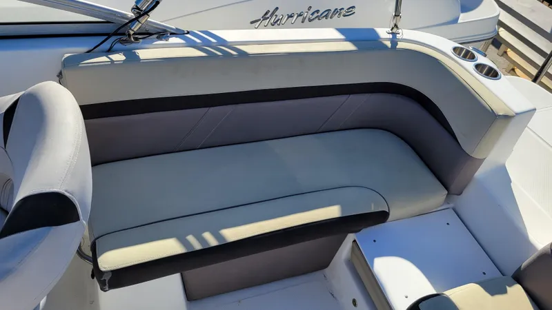 Slide: The Image of 2019 Hurricane SUNDECK 217 PROJECT boat interior with cushioned seating and cup holders. - 19