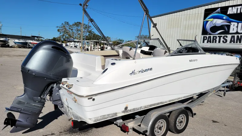 Slide: The Image of 2019 Hurricane SUNDECK 217 PROJECT boat on trailer, outdoor setting. - 3