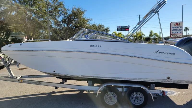 Slide: The Image of 2019 Hurricane SUNDECK 217 boat on trailer, parked outdoors. - 6