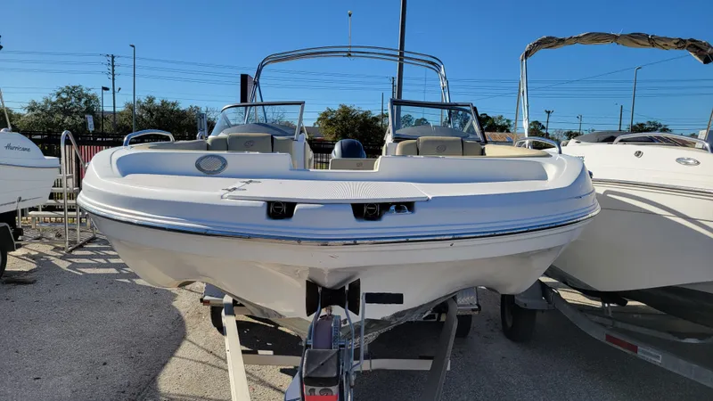 Slide: The Image of 2019 Hurricane SUNDECK 217 PROJECT boat on trailer, front view. - 8