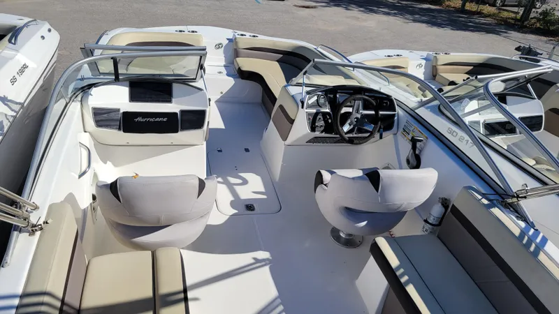 Slide: The Image of 2019 Hurricane SUNDECK 217 PROJECT boat interior with seating and steering console. - 9