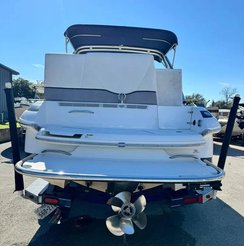 Slide: The Image of 2005 Cobalt GS242 boat, rear view, with propeller and swim platform. - 3