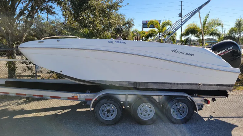 Slide: The Image of 2020 Hurricane SS 192RL boat on trailer, parked outdoors. - 0