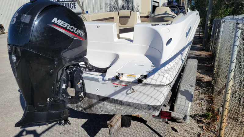 Slide: The Image of 2020 Hurricane SS 192RL PROJECT boat with Mercury outboard motor on trailer. - 2