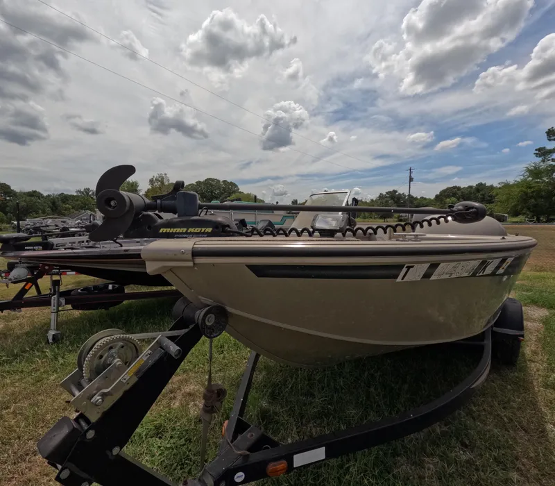 Slide: The Image of 2005 Lowe Fish & Ski FS175 boat on trailer under cloudy sky. - 1