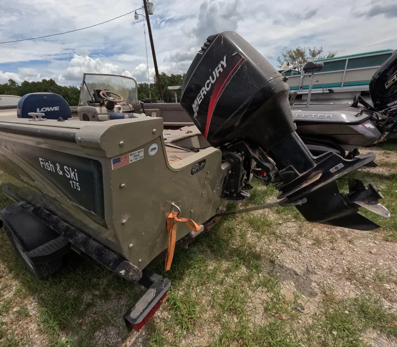 Slide: The Image of 2005 Lowe Fish & Ski FS175 boat with Mercury outboard motor on a trailer. - 19