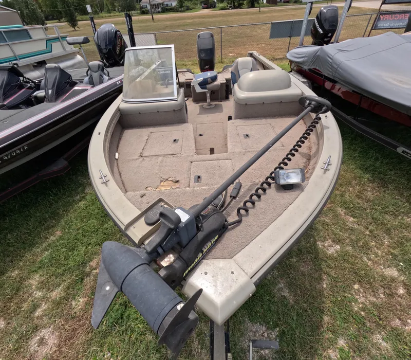 Slide: The Image of 2005 Lowe Fish & Ski FS175 boat on grass, featuring trolling motor and spacious deck. - 2