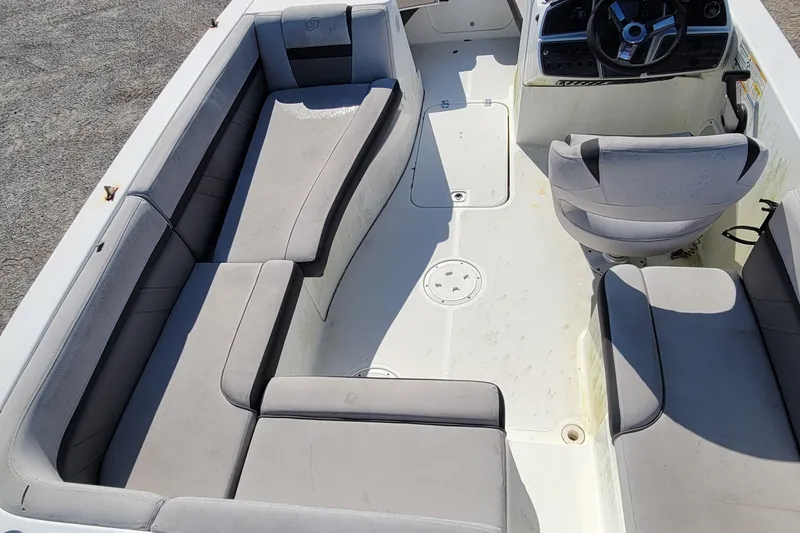 Slide: The Image of 2019 Hurricane SS 192 PROJECT boat interior with gray seating and steering console. - 6