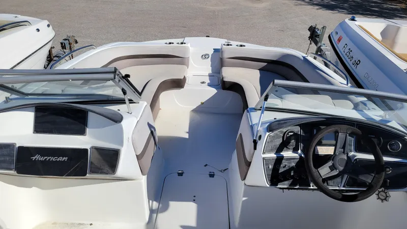 Slide: The Image of 2018 Hurricane SUNDECK 217 PROJECT boat interior with seating and steering wheel. - 10