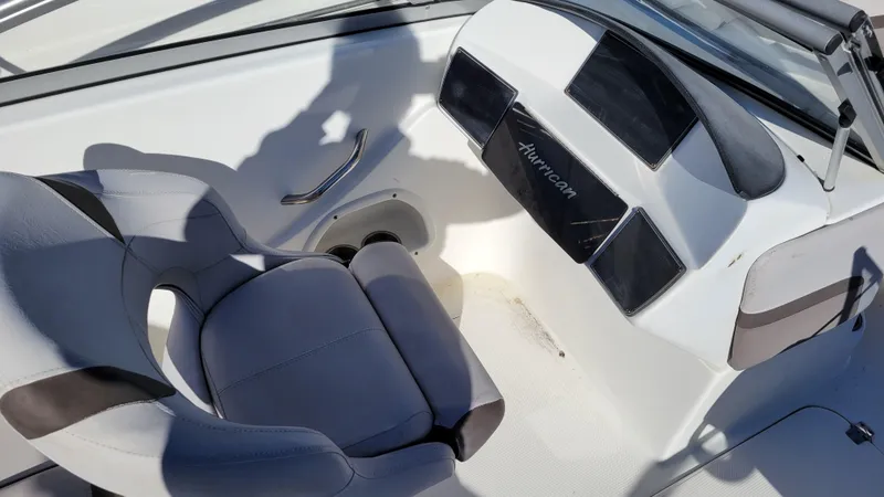 Slide: The Image of 2018 Hurricane SUNDECK 217 PROJECT boat interior with seating and steering area. - 12