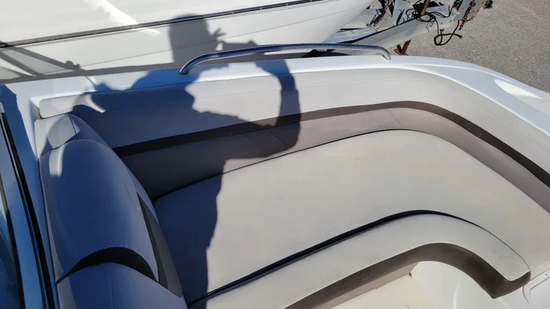 Slide: The Image of 2018 Hurricane SUNDECK 217 PROJECT boat interior with cushioned seating and shadow. - 13