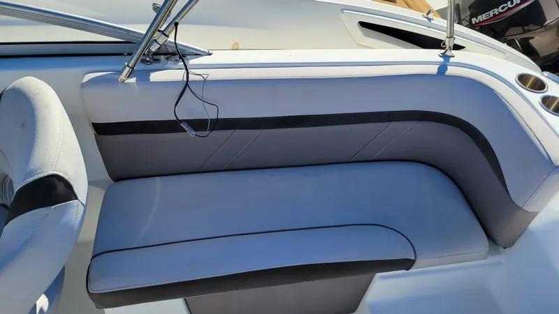 Slide: The Image of 2018 Hurricane SUNDECK 217 boat interior seating with gray upholstery. - 19