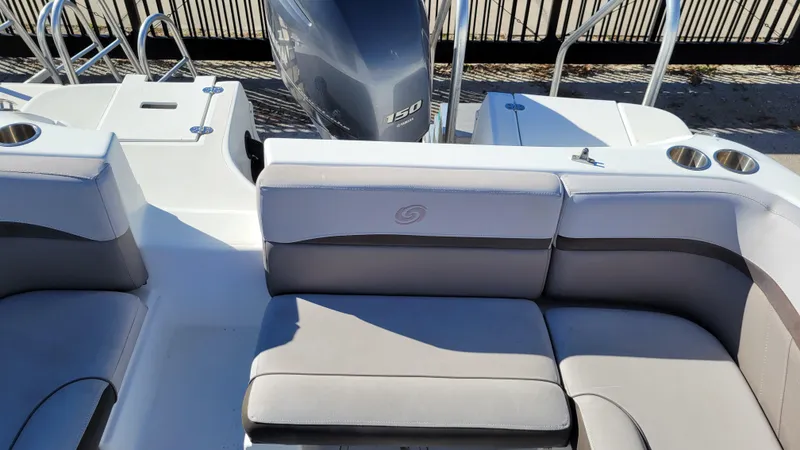 Slide: The Image of 2018 Hurricane SUNDECK 217 boat interior with seating and outboard motor. - 20