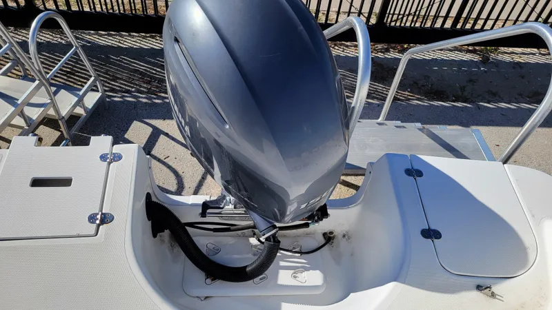Slide: The Image of 2018 Hurricane SUNDECK 217 PROJECT boat engine and deck view. - 22
