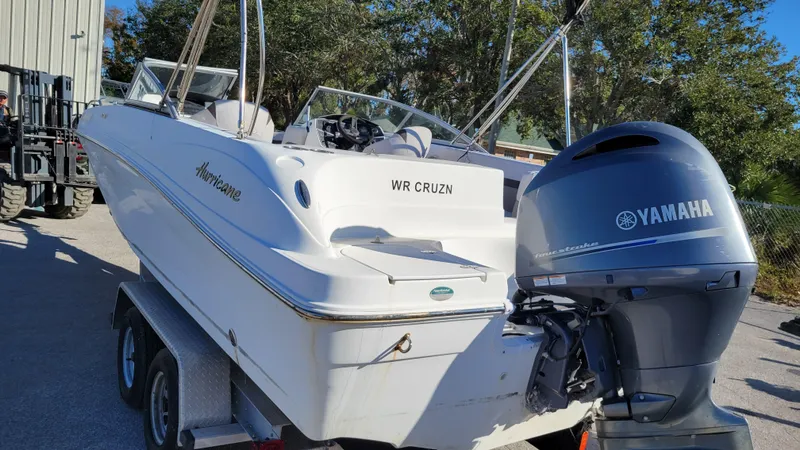 Slide: The Image of 2018 Hurricane SUNDECK 217 boat with Yamaha outboard motor on trailer. - 5