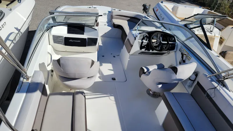 Slide: The Image of 2018 Hurricane SUNDECK 217 PROJECT boat interior with seating and steering console. - 9