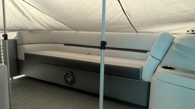 Slide: The Image of 2024 Godfrey Pontoons Sweetwater 2286 SFL interior seating under canopy. - 5
