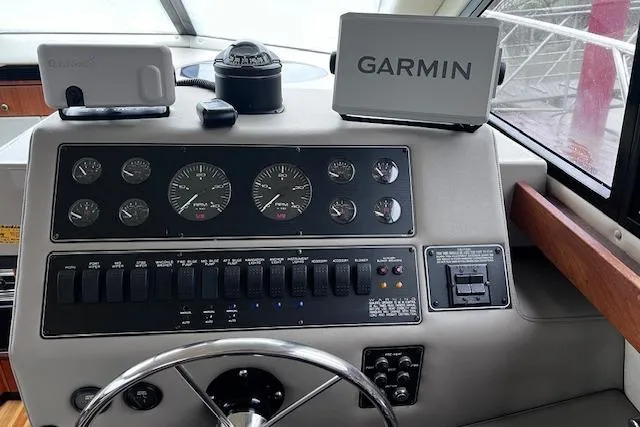 Slide: The Image of 1996 Bayliner 3388 Command Bridge Motoryacht helm with Garmin navigation system. - 26