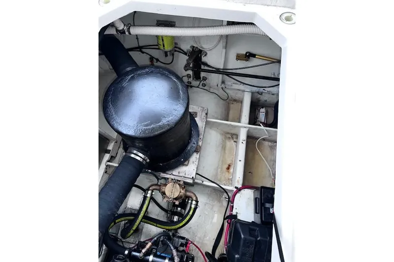 Slide: The Image of Engine compartment of 1996 Bayliner 3388 Command Bridge Motoryacht, showing mechanical components. - 29