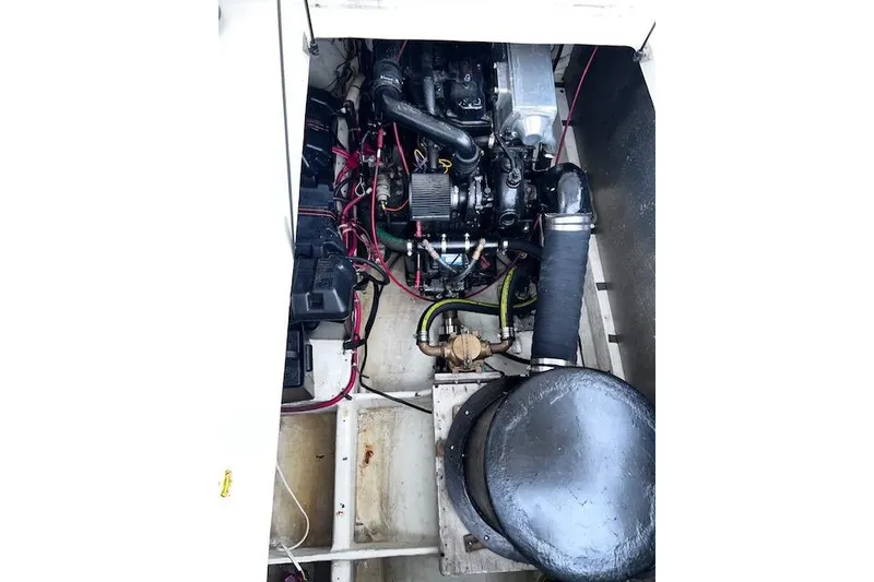 Slide: The Image of Engine compartment of 1996 Bayliner 3388 Command Bridge Motoryacht, showcasing mechanical components. - 33