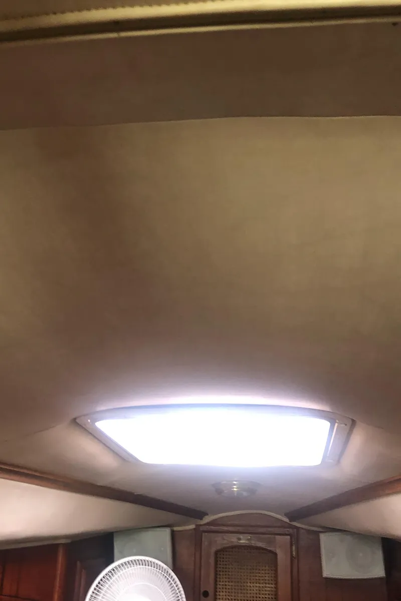 Slide: The Image of Interior ceiling of a 1980 Lancer 36 boat with skylight and fan. - 44