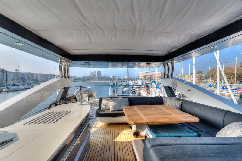 Slide: The Image of Luxurious 2017 Sunseeker 75 Yacht interior with elegant seating and marina view. - 13