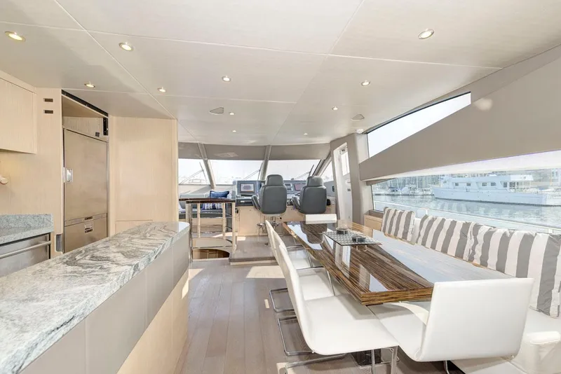 Slide: The Image of Luxurious interior of 2017 Sunseeker 75 Yacht with modern dining area and helm. - 18