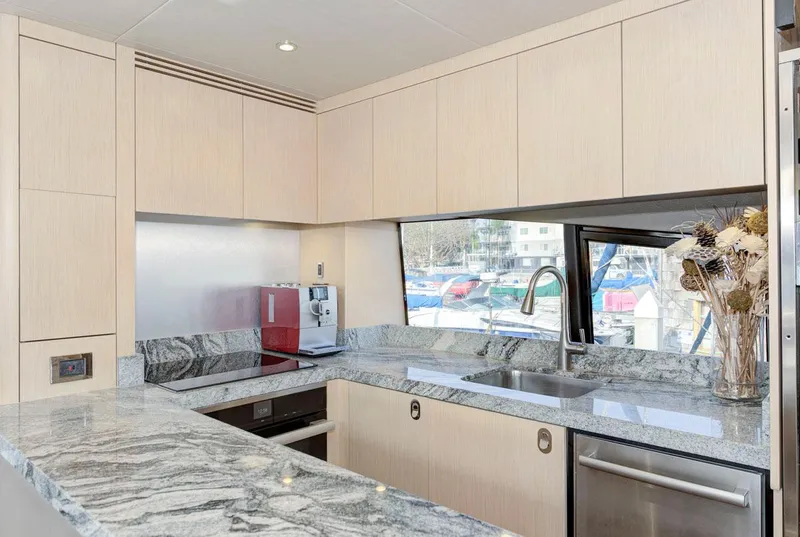 Slide: The Image of Luxurious kitchen interior of 2017 Sunseeker 75 Yacht with modern appliances and granite countertops. - 20