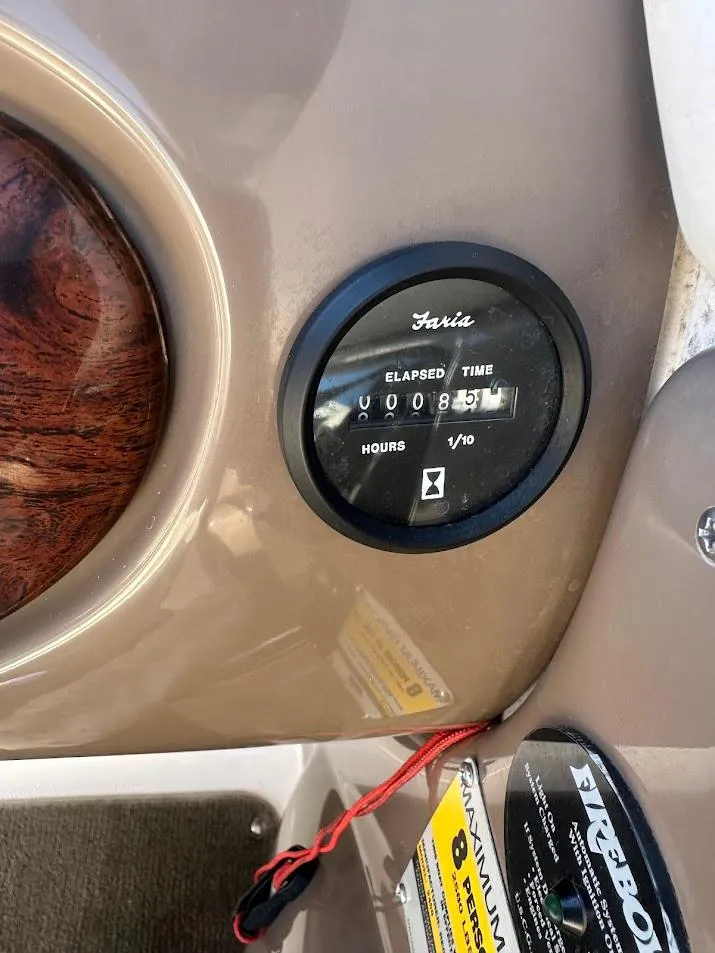 Slide: The Image of Hour meter on 2006 Regal 2450 Cuddy boat dashboard, showing 81.6 hours. - 20