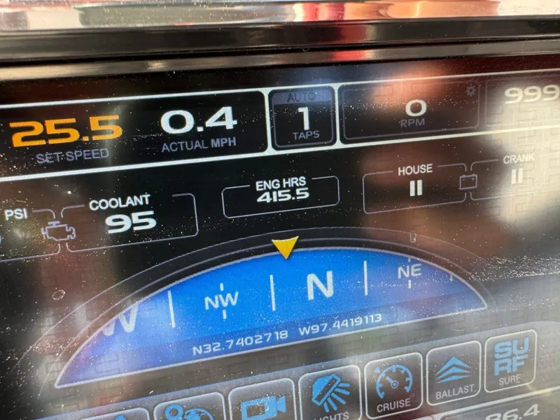 Slide: The Image of Dashboard of a 2016 Tigé RZ2 boat showing speed, engine hours, and navigation details. - 13