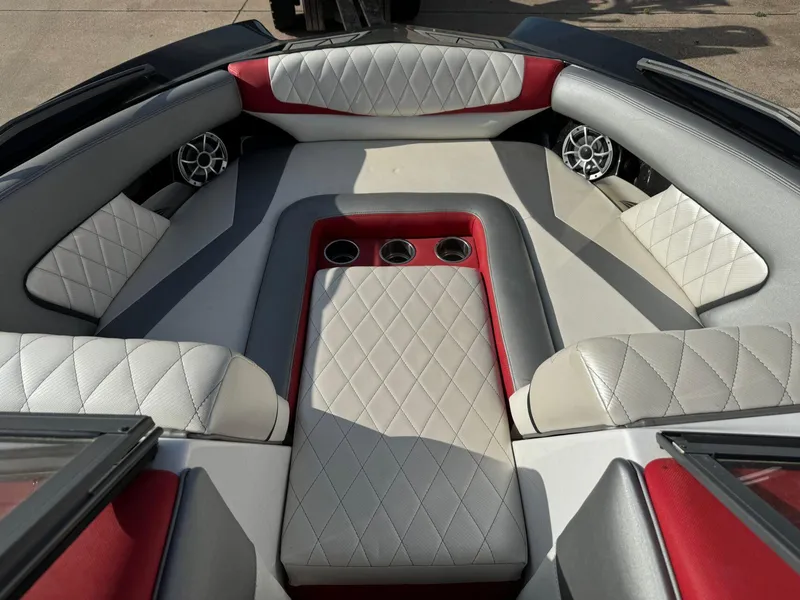 Slide: The Image of 2016 Tigé RZ2 boat interior with diamond-stitched upholstery and cup holders. - 7