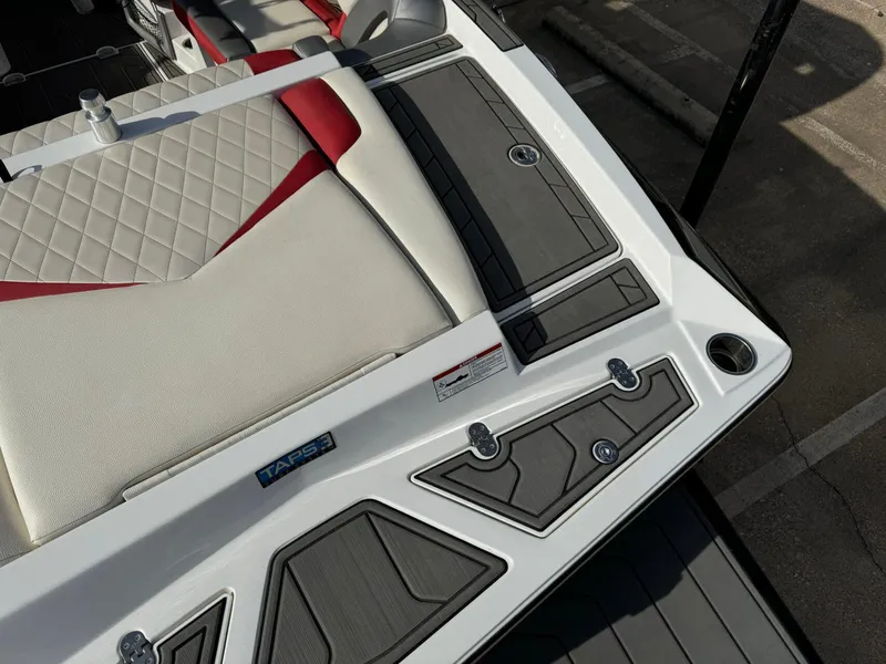 Slide: The Image of 2016 Tigé RZ2 boat interior with quilted seats and sleek design details. - 8