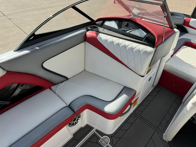 Slide: The Image of 2016 Tigé RZ2 boat interior with red and white seating, modern design. - 9