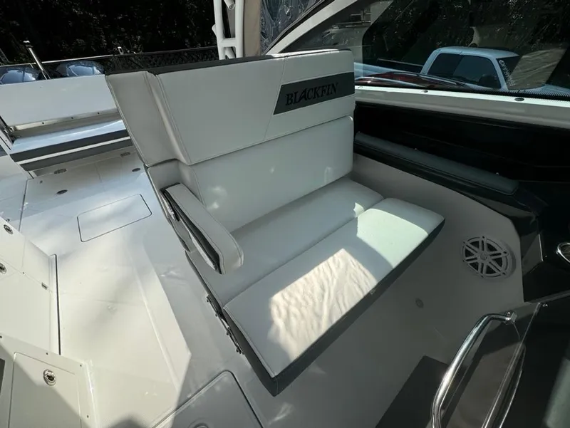 Slide: The Image of 2020 Blackfin 272 DC boat interior with white seating and sleek design. - 12