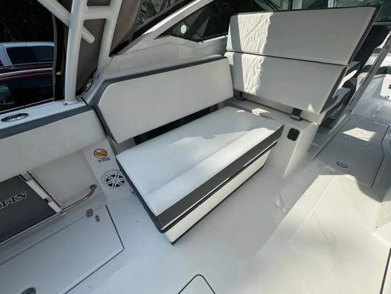 Slide: The Image of 2020 Blackfin 272 DC boat interior with white seating and sleek design. - 13
