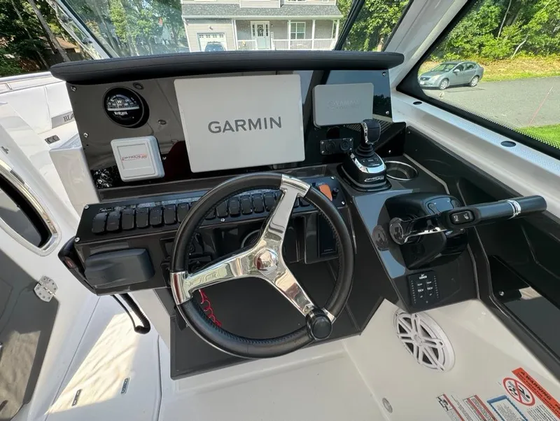 Slide: The Image of 2020 Blackfin 272 DC boat dashboard with Garmin navigation system and steering wheel. - 18