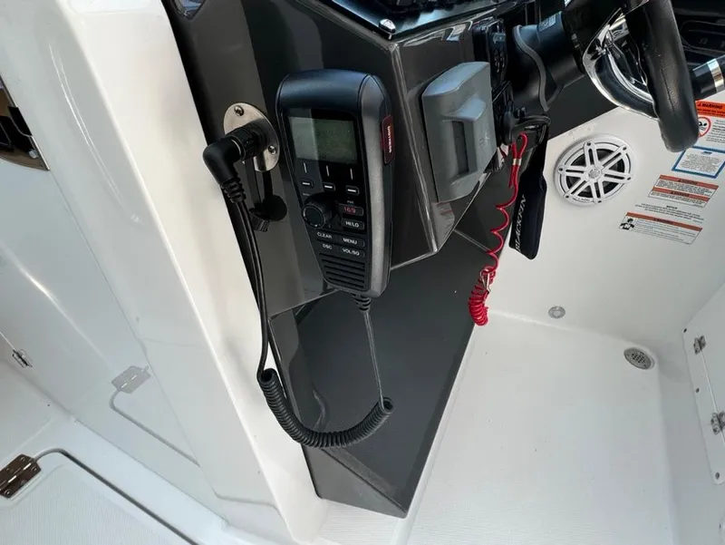 Slide: The Image of 2020 Blackfin 272 DC boat dashboard with radio and controls. - 22