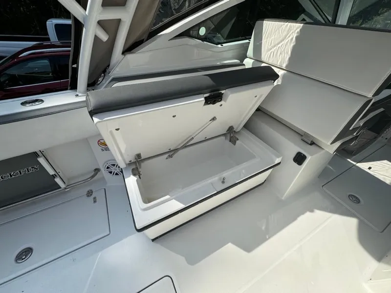 Slide: The Image of 2020 Blackfin 272 DC boat interior with open storage compartment. - 28
