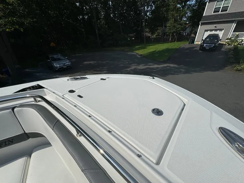 Slide: The Image of 2020 Blackfin 272 DC boat deck in a residential driveway setting. - 39