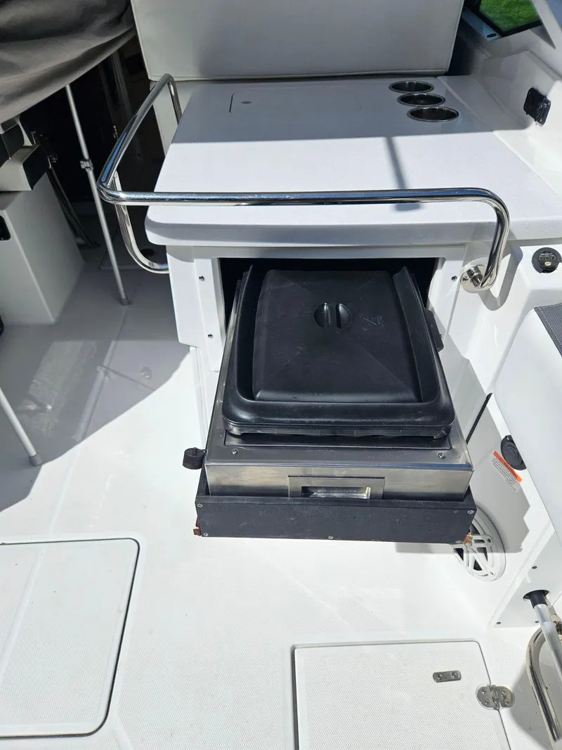 Slide: The Image of 2020 Blackfin 272 DC boat with built-in grill and storage compartment. - 46
