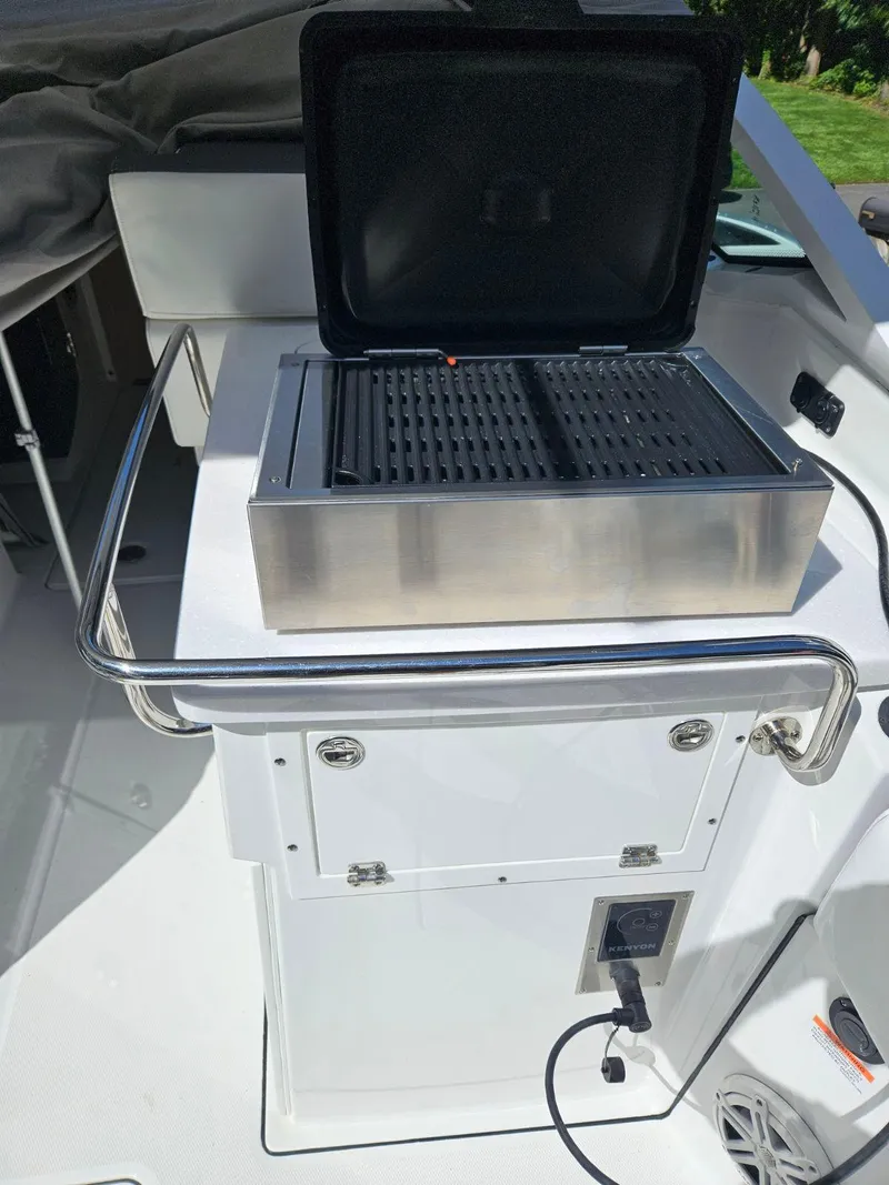 Slide: The Image of 2020 Blackfin 272 DC boat with built-in grill on deck. - 48