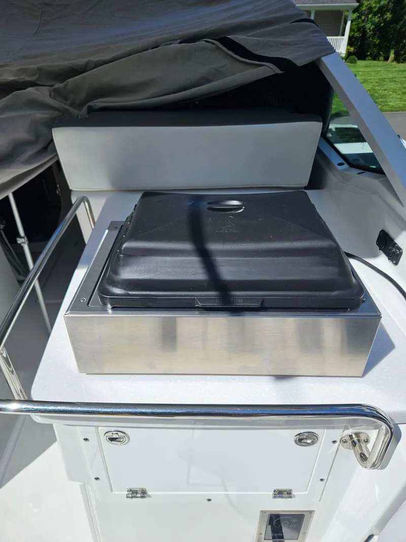 Slide: The Image of 2020 Blackfin 272 DC boat with covered equipment on deck. - 49