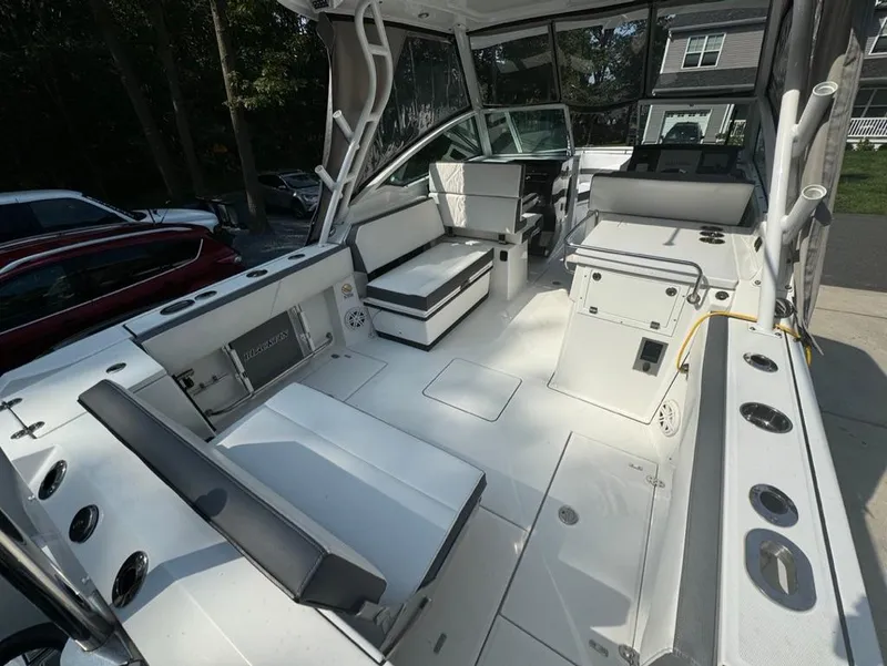 Slide: The Image of 2020 Blackfin 272 DC boat interior with seating and storage compartments. - 6