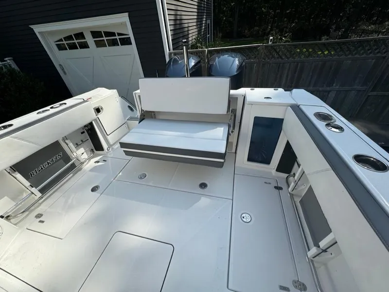 Slide: The Image of 2020 Blackfin 272 DC boat deck with seating and storage compartments. - 9