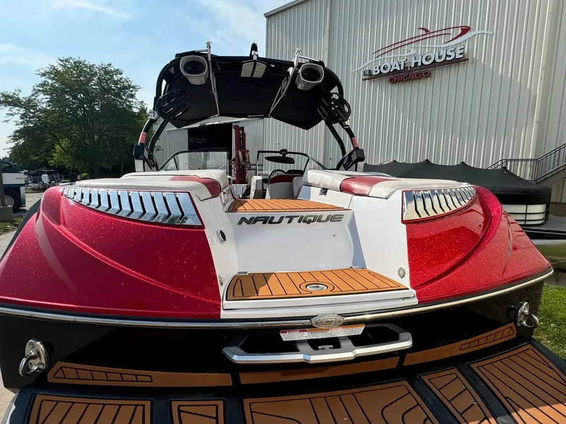 Slide: The Image of 2014 Nautique G23 boat with red and white design at Chicago Boat House. - 7
