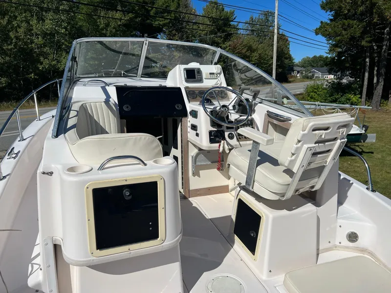 Slide: The Image of 1998 Grady-White Voyager 268 boat interior with steering wheel and seating. - 13